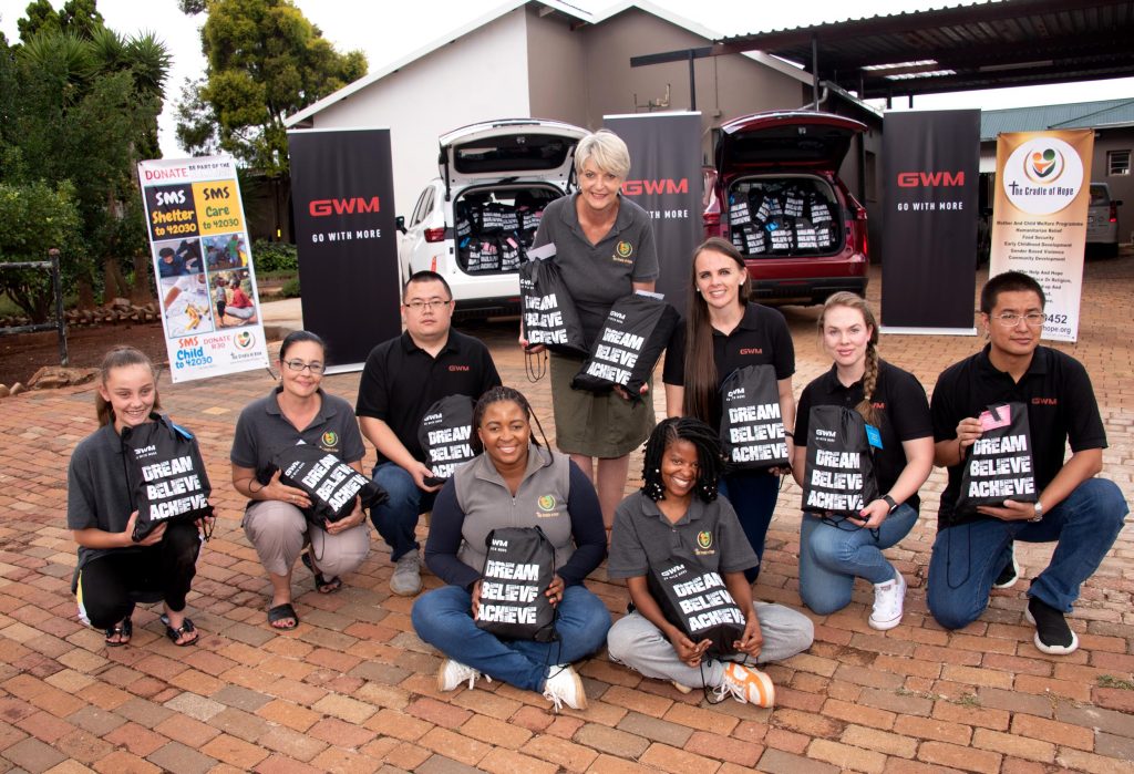 Celebrating the donation of hundreds of personalised gift bags - members of GWM SA and Cradle of Hope